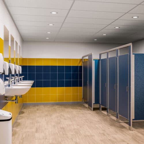 A public restroom features commercial bathroom partitions, with sinks and hand dryers on the left and a row of closed stalls on the right. The walls boast blue and yellow panels, while the floor is light-colored wood.