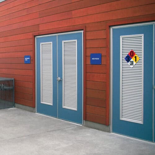 Two blue Pebble Grain Hybrid FRP doors with shutters are labeled 