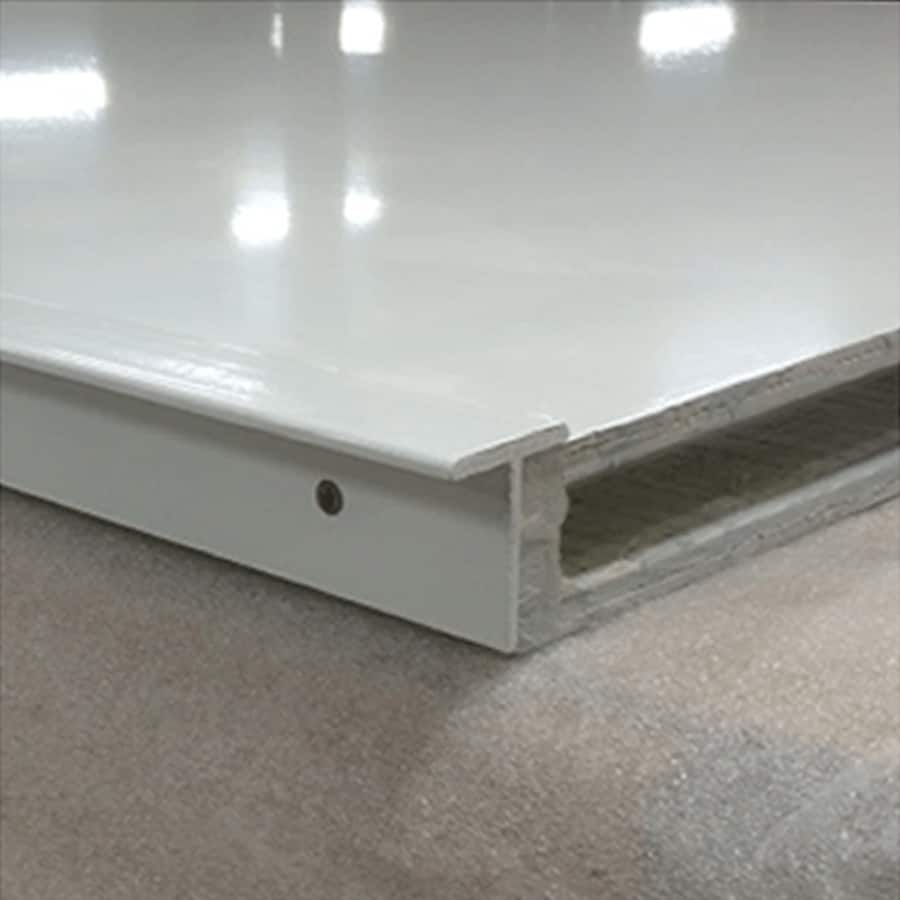 An image of a white floor with a hole in it.