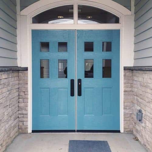A blue front door with white trim.