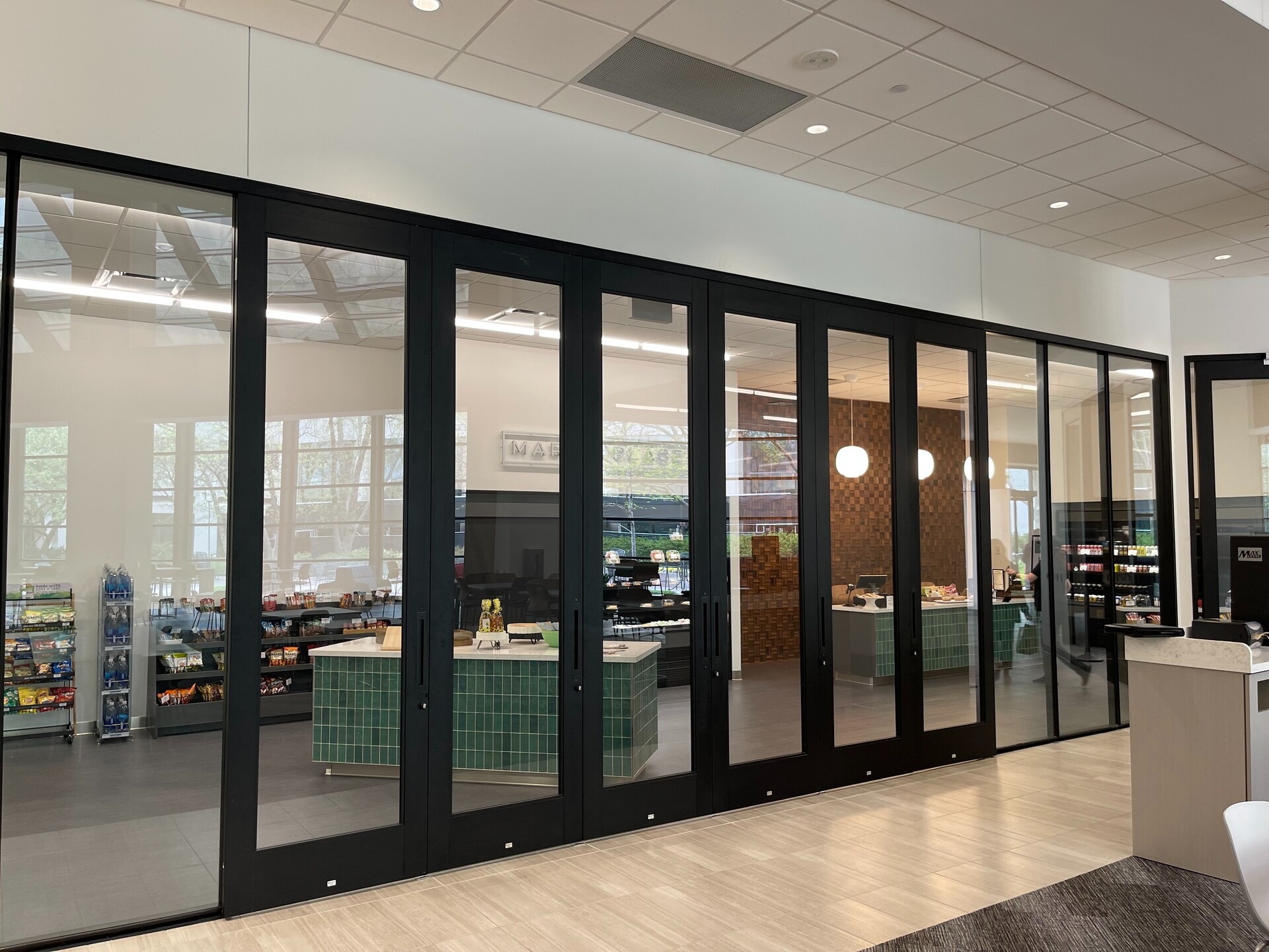 A sliding door system solution for a cafe in an office building.