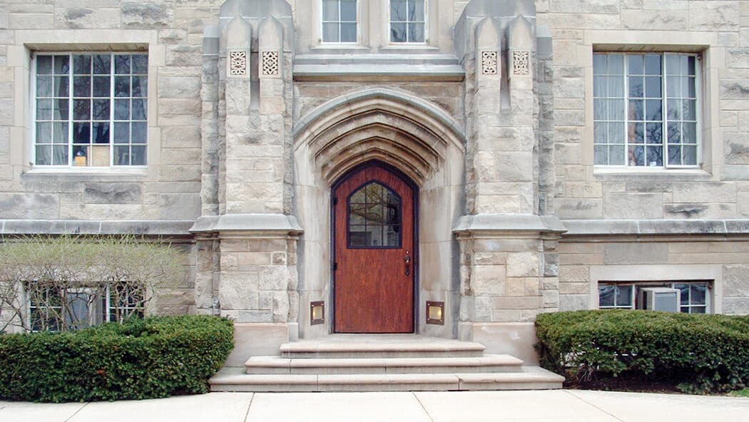 This church entrance shows a wood grain door with a half lite window kit and a curved top.