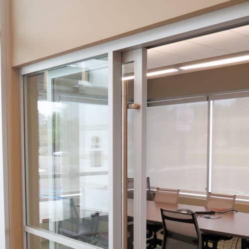 A glass sliding door in a conference room.