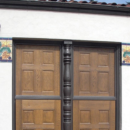 A pair of door featuring SL-38 architectural panels with a wood grain panels.