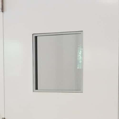 A white door with a mirror on it.