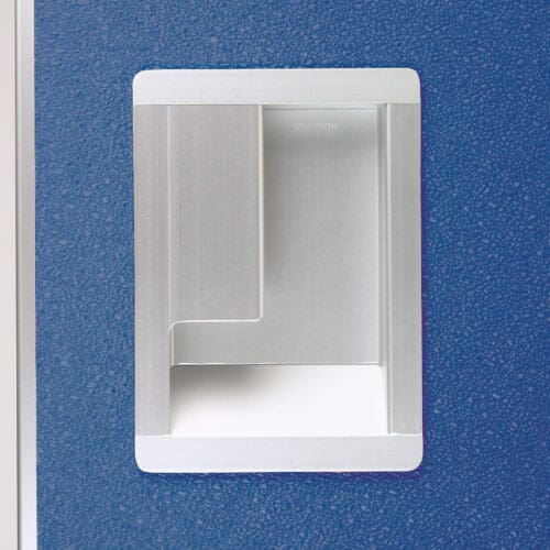 A blue wall with a small white box on it.