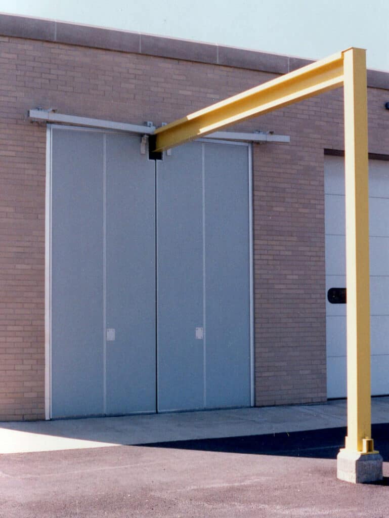 Two large blue gray doors show from outside. 