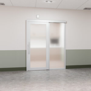 A hospital room with a sliding glass door.