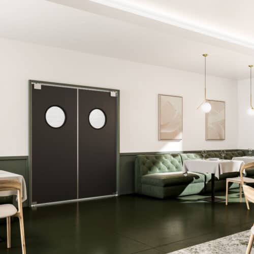 A modern dining area with green velvet seating, wooden chairs, circular pendant lights, framed abstract artwork, and double traffic doors with round windows.