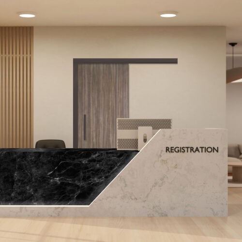 Modern registration desk featuring a marble and black front panel, office chair, and neutral-colored walls, complemented by stylish Plastic Laminate (HPDL) Doors in a well-lit reception area.